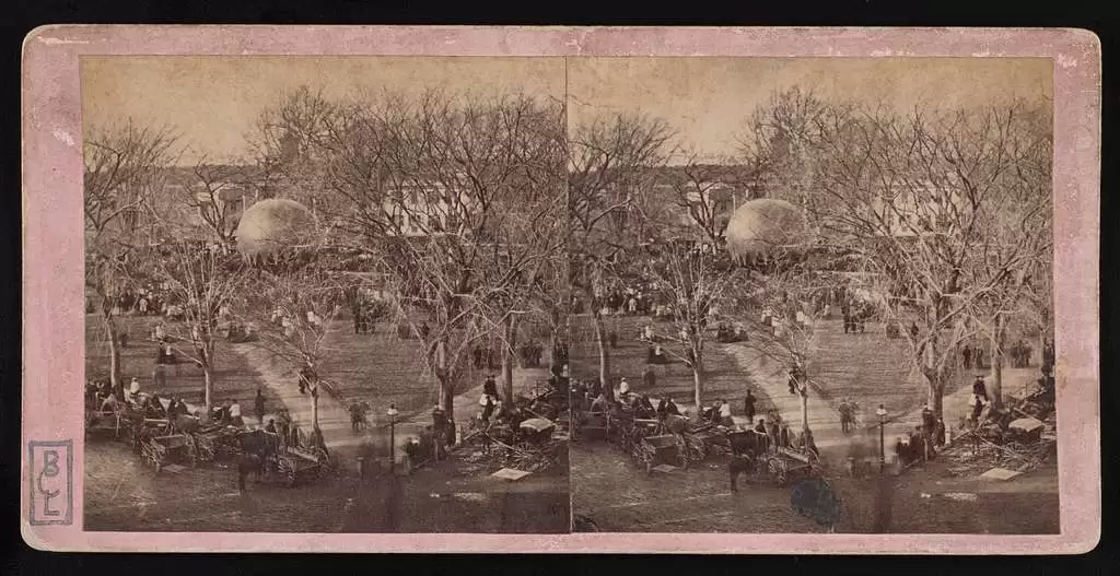 an old photo showing the Boston Common park bustling with people 